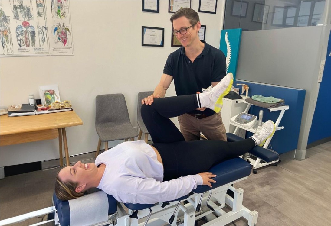 Satisfied patient smiling after a successful chiropractic session at The Chiro Studio in Adamstown, NSW